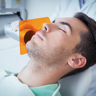 sedation-dentist-woman-in-dental-chair-relaxed